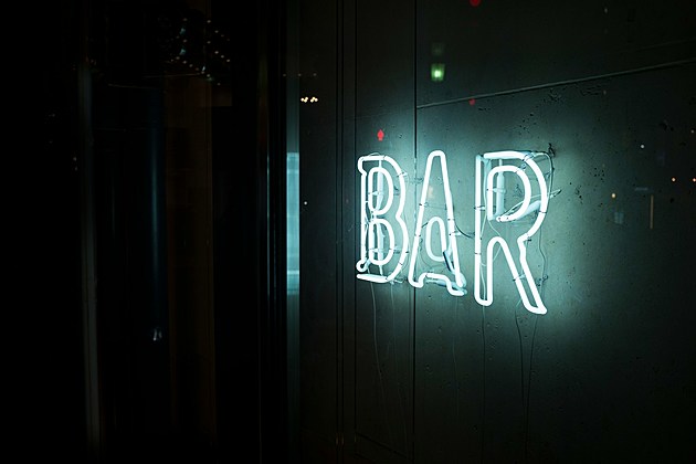 neon sign that says BAR